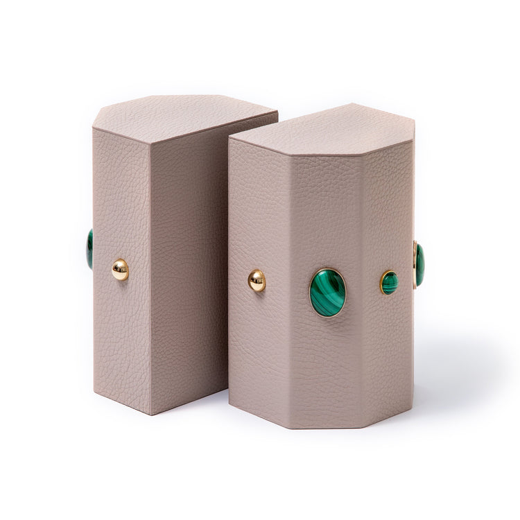 Madame Malachite A powerful protection stone, Black Onyx absorbs and transforms negative energy, wherever you may choose to keep it. Timeless and tasteful bookends jeweled with natural stones to increase the energy in you home. Perfect decorative pieces for for your cabinet of curiosities. %100 Leather (Floater leather)