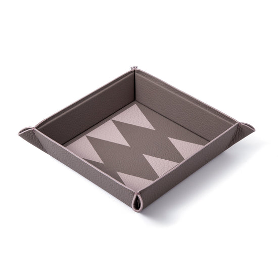 Vide poche trays meant to lighten up your load, and give you joy wherever you choose to place them. 100% Leather